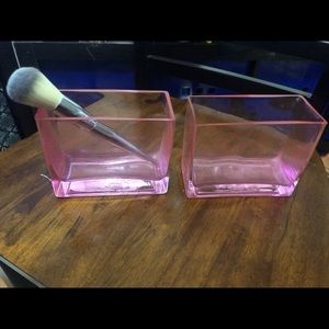 2 pink glass brush holders/pencil holders.